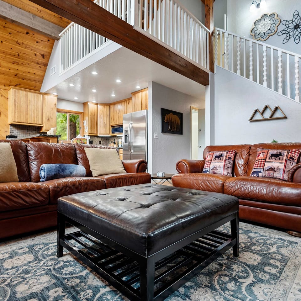Living area with leather seating, fireplace, and Smart TV