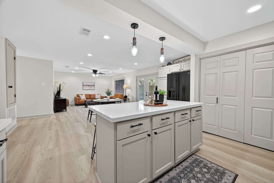 Kitchen: Light-filled space with modern appliances and a stylish island for culinary adventures!