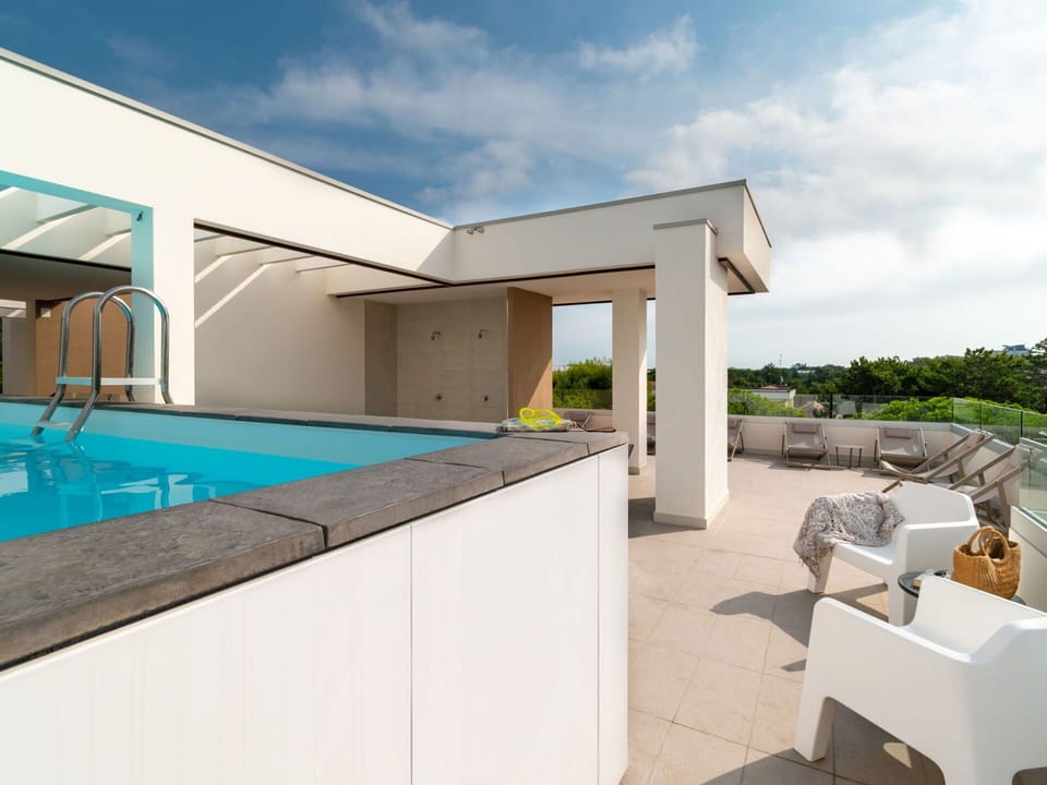 Sky, Cloud, Property, Water, Plant, Building, Azure, Shade, Floor, Swimming Pool