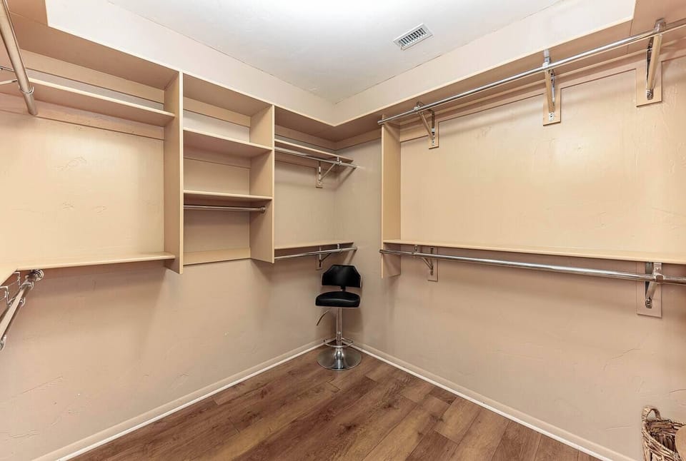 Spacious walk-in closet with shelving