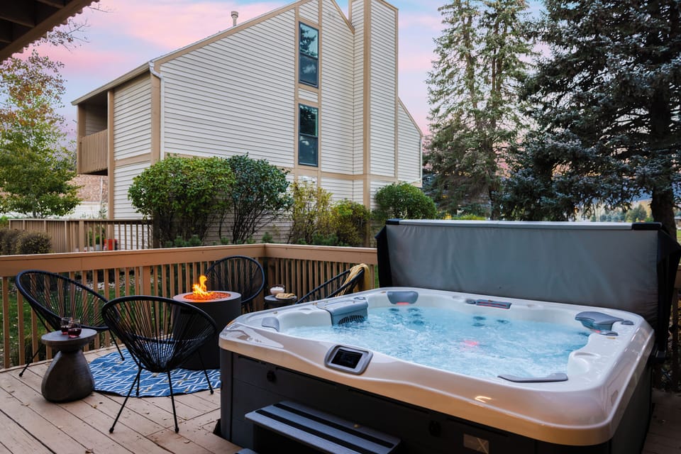 Outdoor deck with private hot tub, BBQ grill, and firepit.