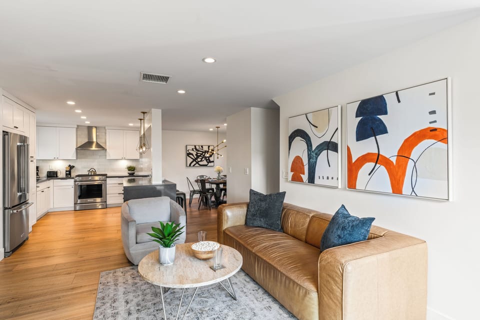 Living room with contemporary art and neutral tones.