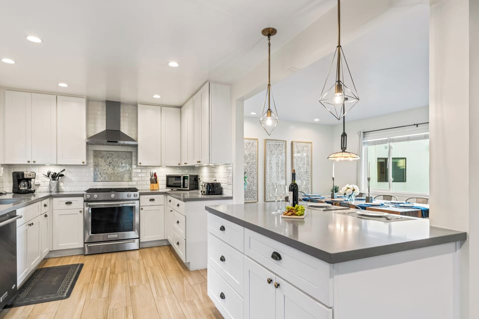 Spacious kitchen with a center island and modern finishes.
