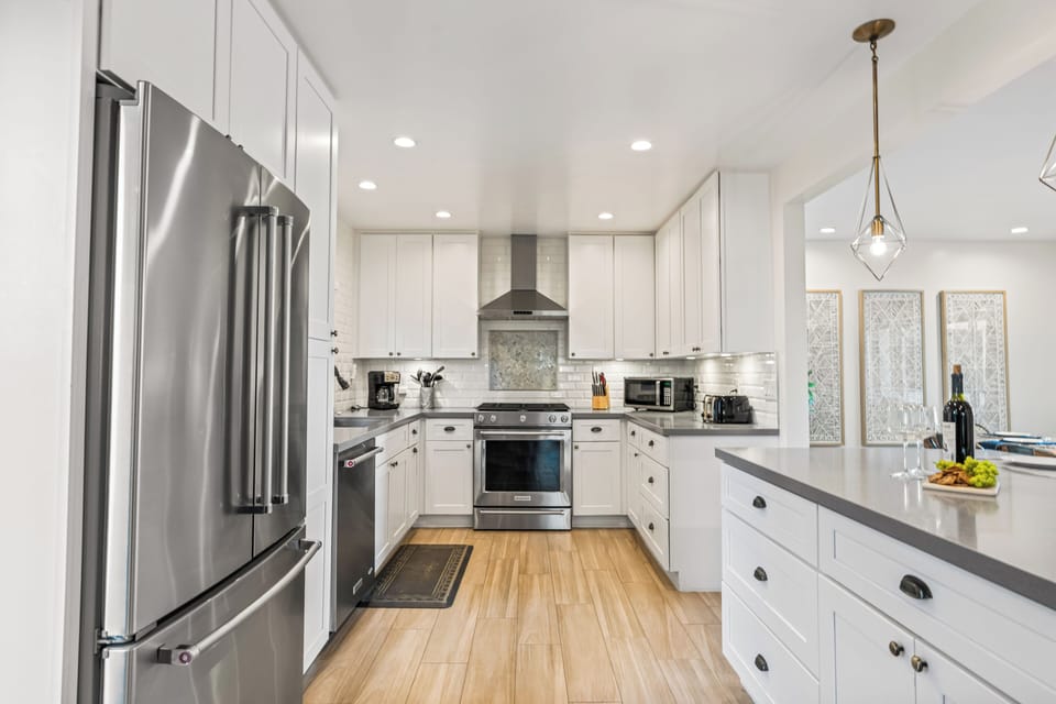 Fully equipped kitchen with stainless steel appliances.
