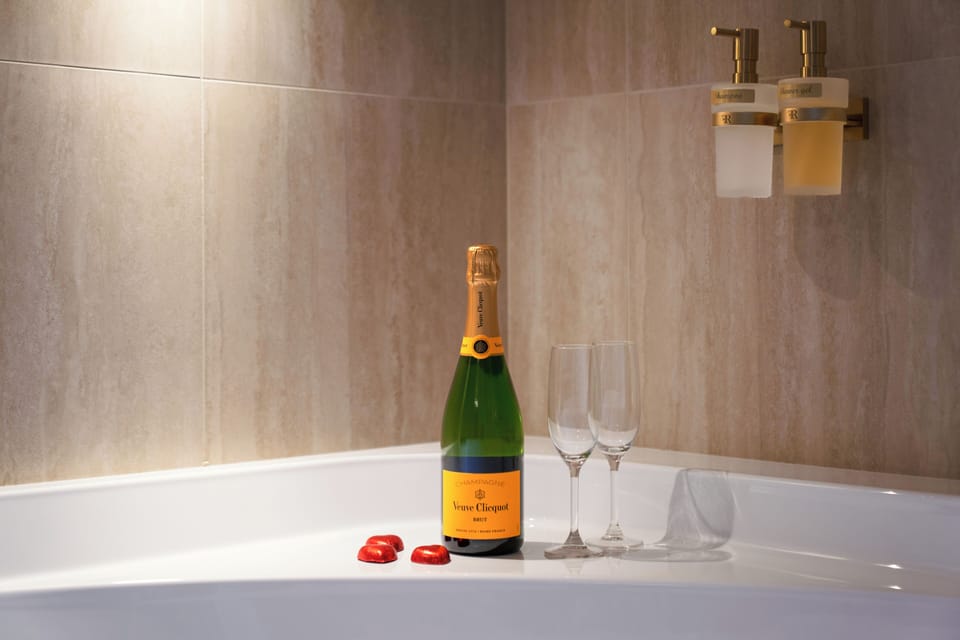 Luxury Triple Room, City View | Bathroom | Hair dryer, slippers, towels, soap