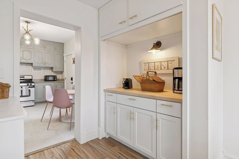 The coffee station includes a nespresso machine and drip coffee maker 