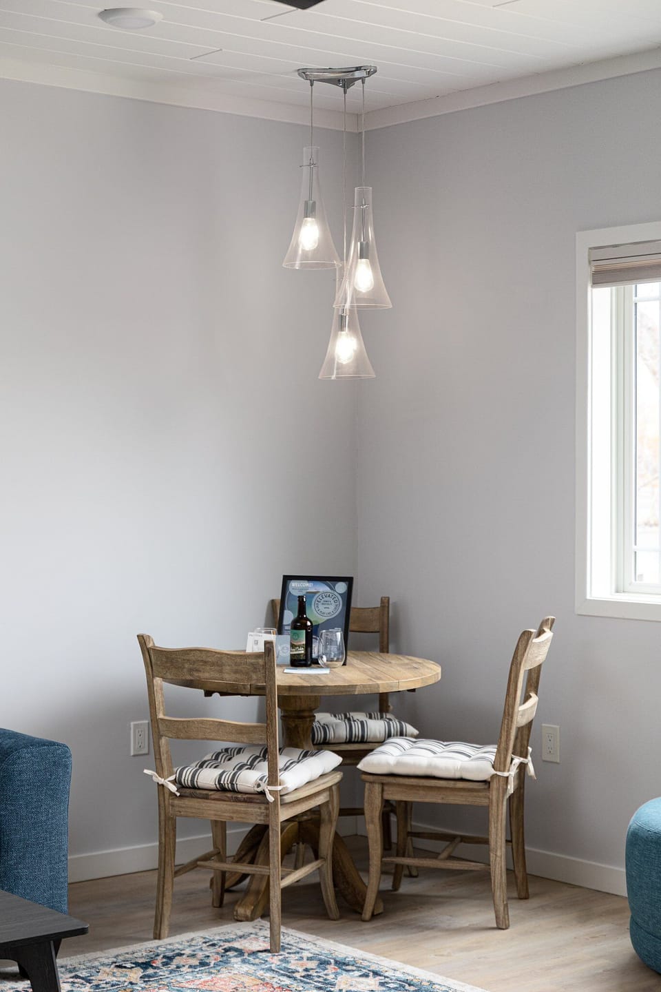 Intimate dining table for two, perfect for morning coffee or relaxed evening meals.
