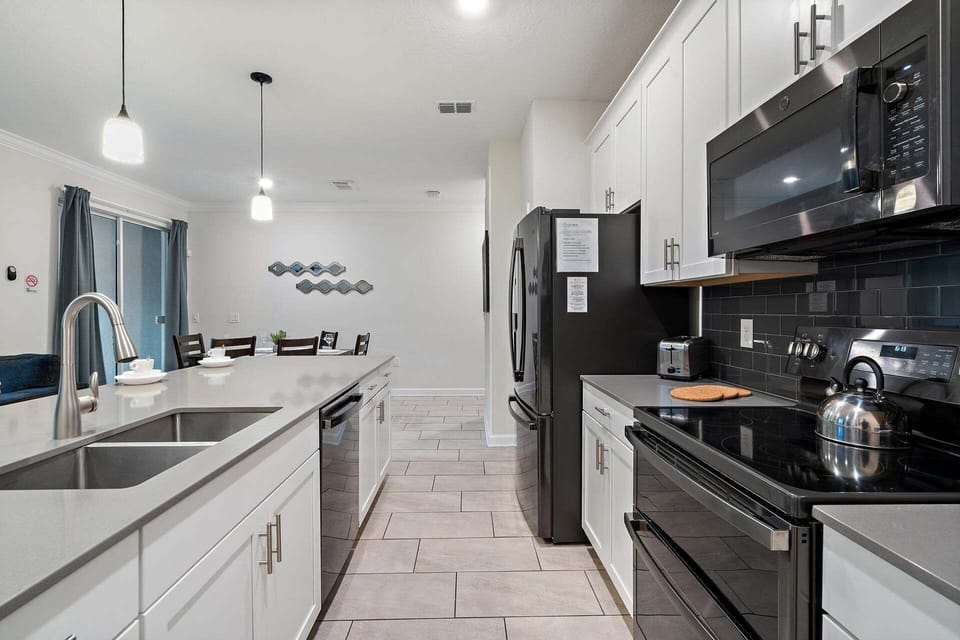 Townhome, 4 Bedrooms | Private kitchen | Coffee/tea maker, fridge, oven, toaster