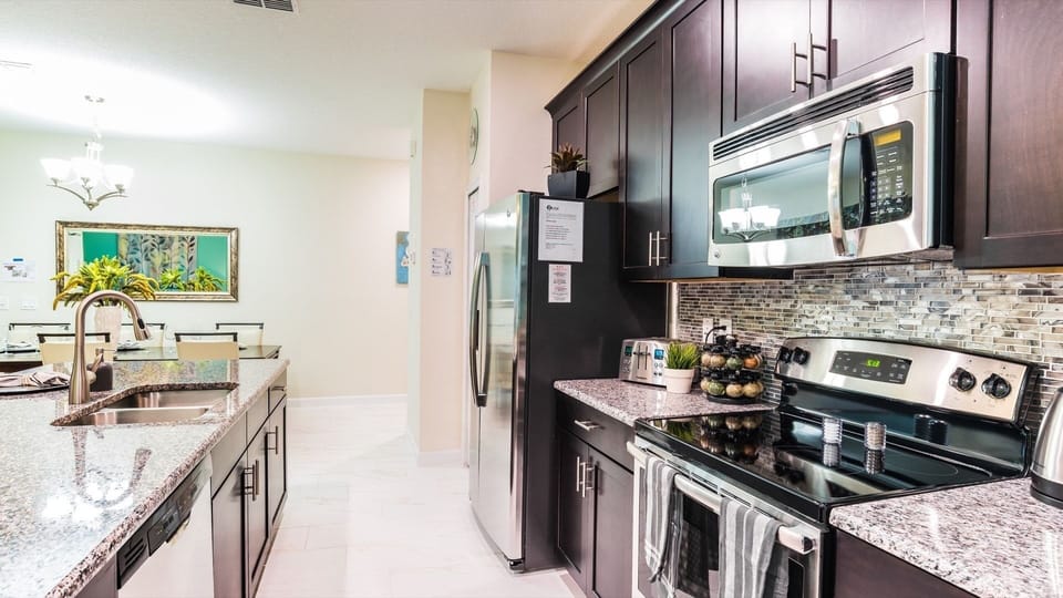 Townhome, 4 Bedrooms | Private kitchen | Coffee/tea maker, fridge, oven, toaster