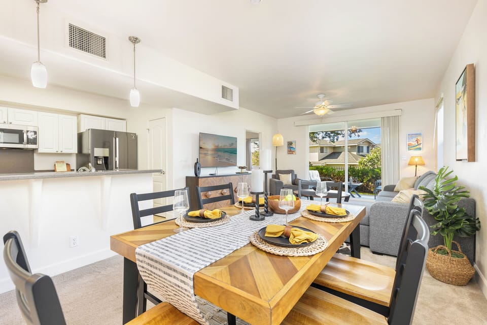 Bright dining area with a direct look into the stylish kitchen