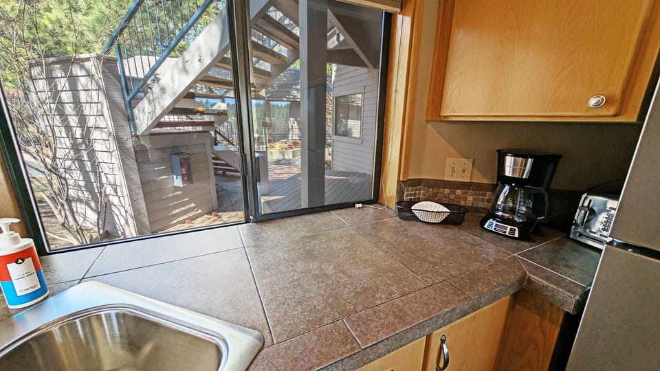 Condo, 2 Bedrooms | Private kitchen | Fridge, oven, coffee/tea maker