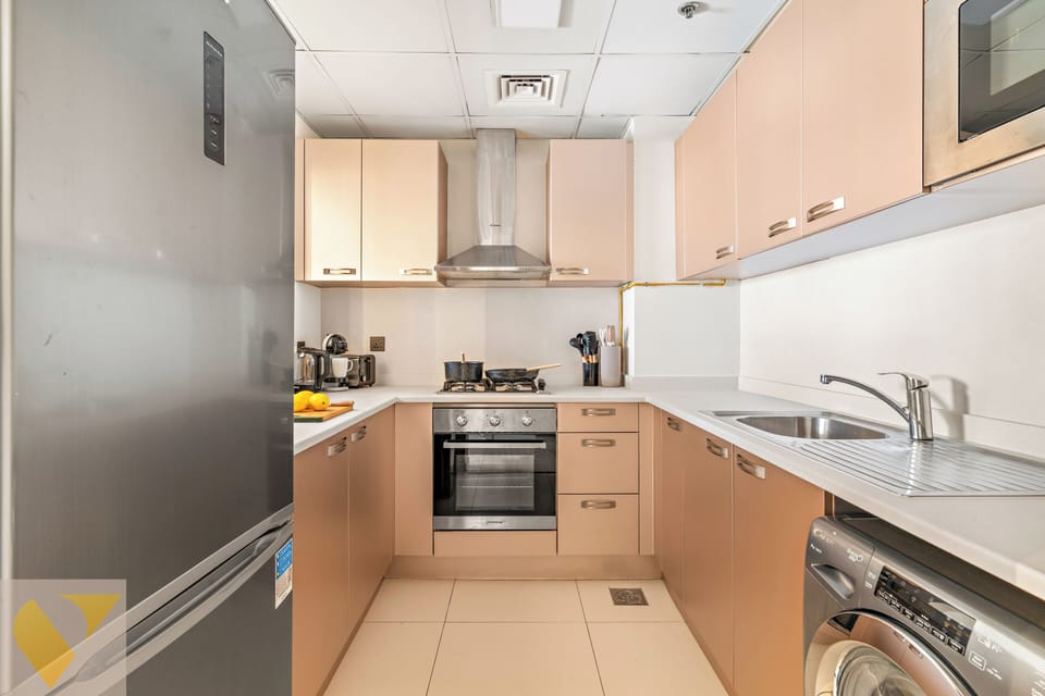 Luxury Apartment, Balcony, City View | Private kitchen | Full-size fridge, microwave, oven, stovetop