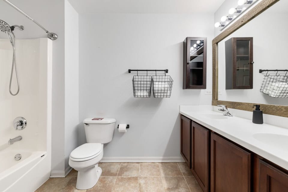 Bright bathroom with fresh towels and essentials provided