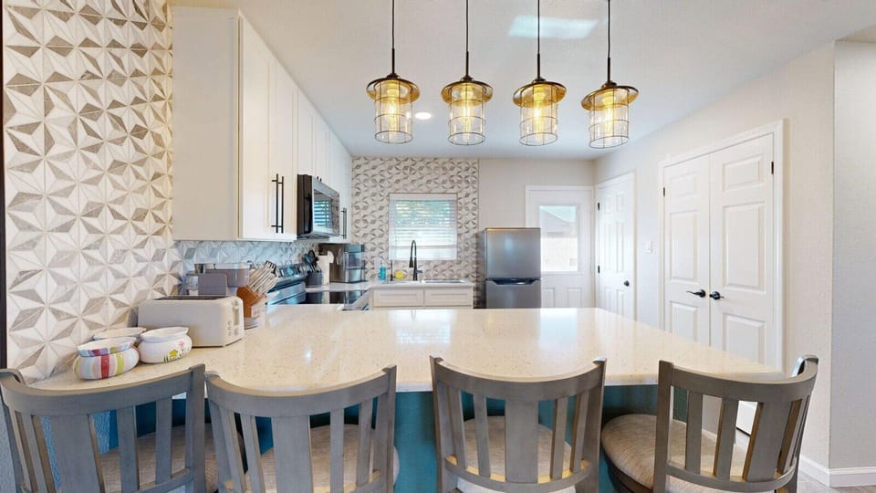 Counter seating for four, perfect for meals, snacks, or morning coffee
