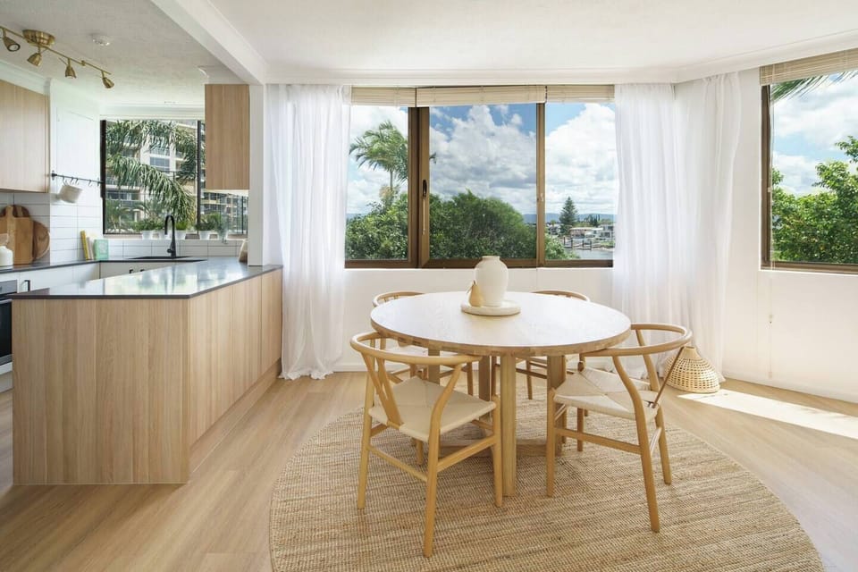 Dine at the four-seater table with leafy views of the adjacent riverfront.