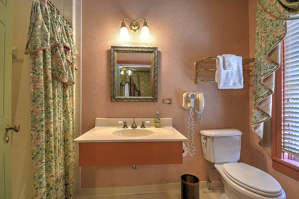 Full-sized bath with amenities and tub