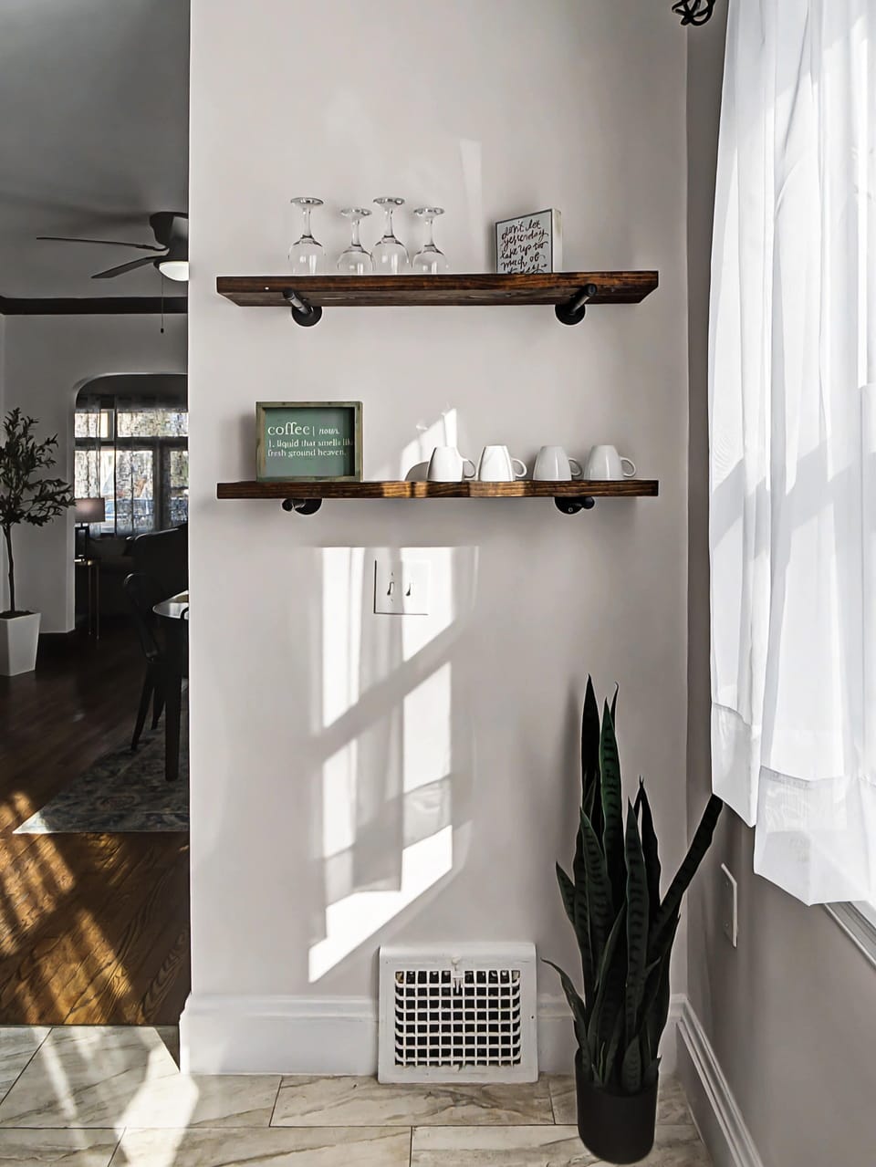 Minimalist corner w/ floating shelves & natural light