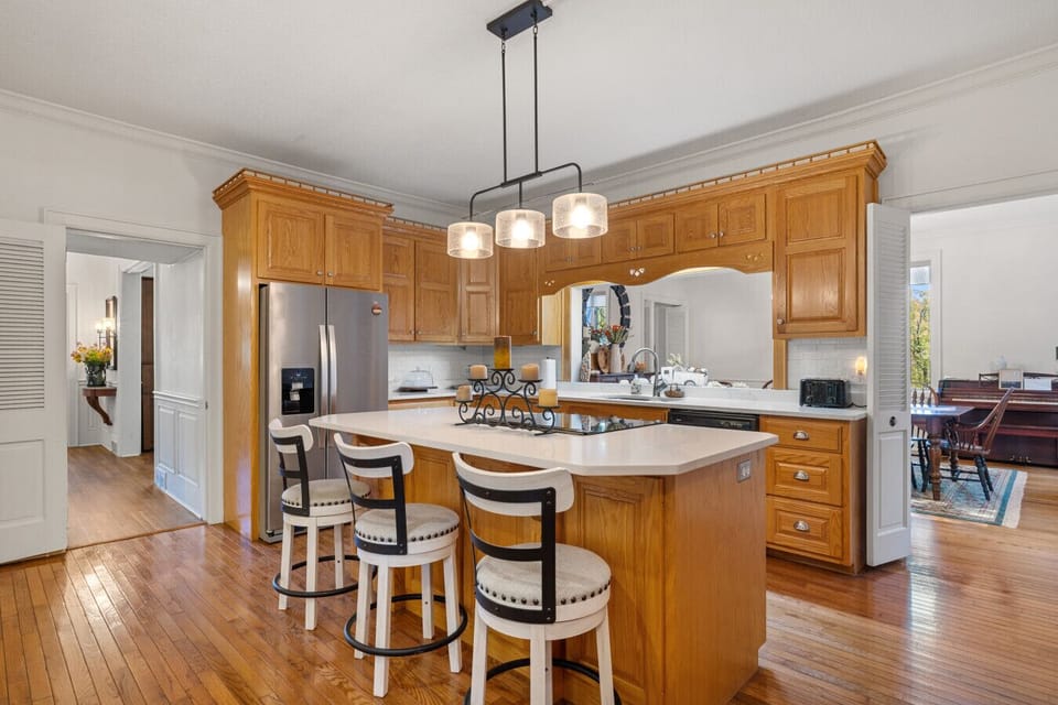 Bright and spacious kitchen | Modern appliances with classic wood cabinetry | Perfect for cooking and gathering