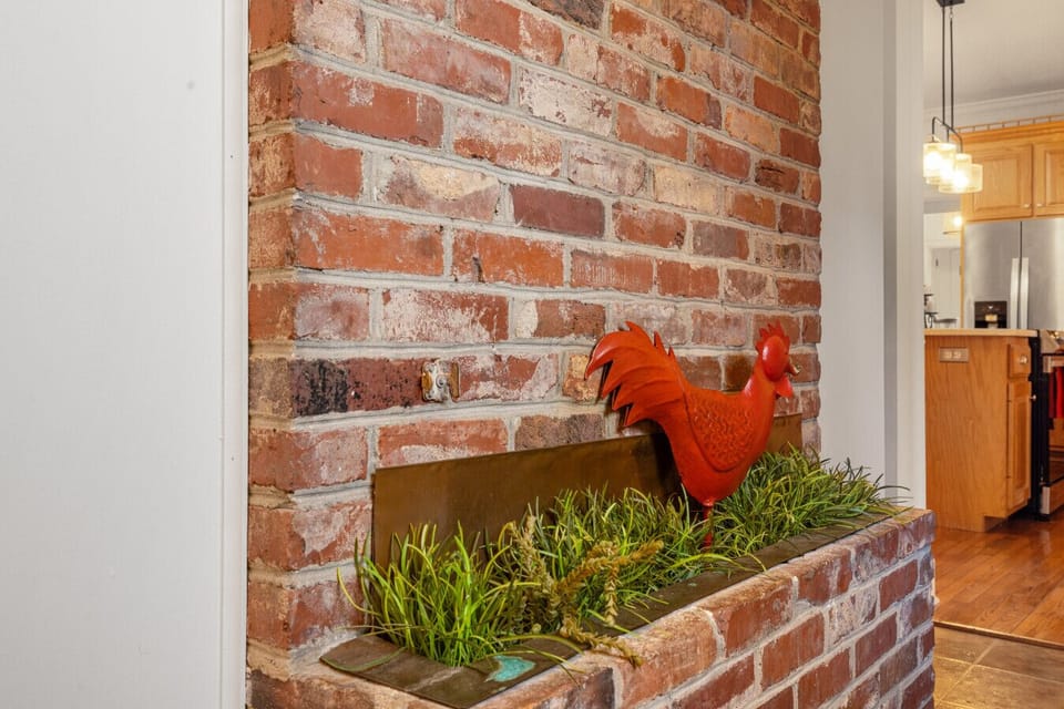 Rustic hallway with brick accents | Functional space with cozy charm | Seamless flow to the kitchen