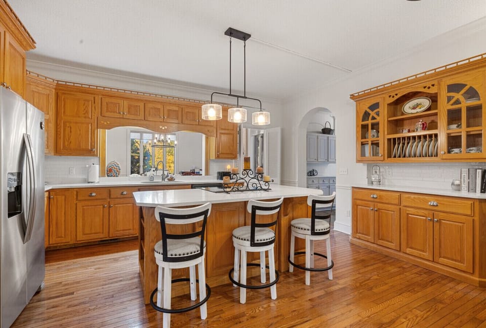 Bright and spacious kitchen | Modern appliances with classic wood cabinetry | Perfect for cooking and gathering