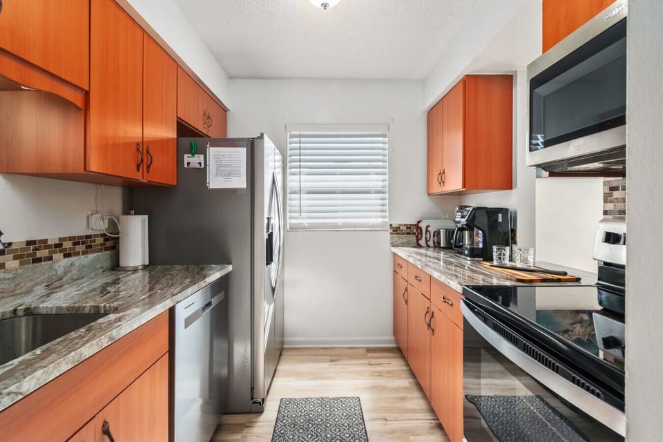 Kitchen | Fully equipped with stainless steel appliances and ample counter space