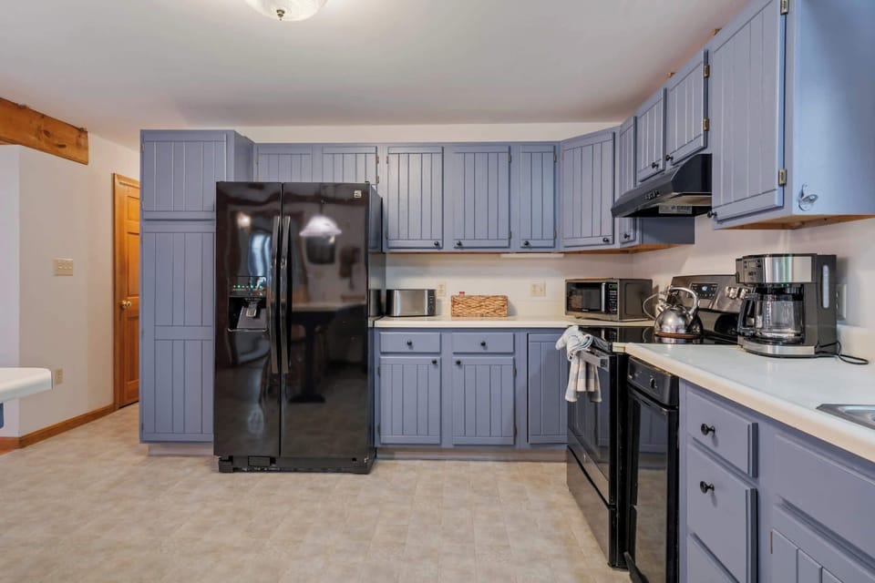 The open kitchen offers ample space & all the comforts of home​