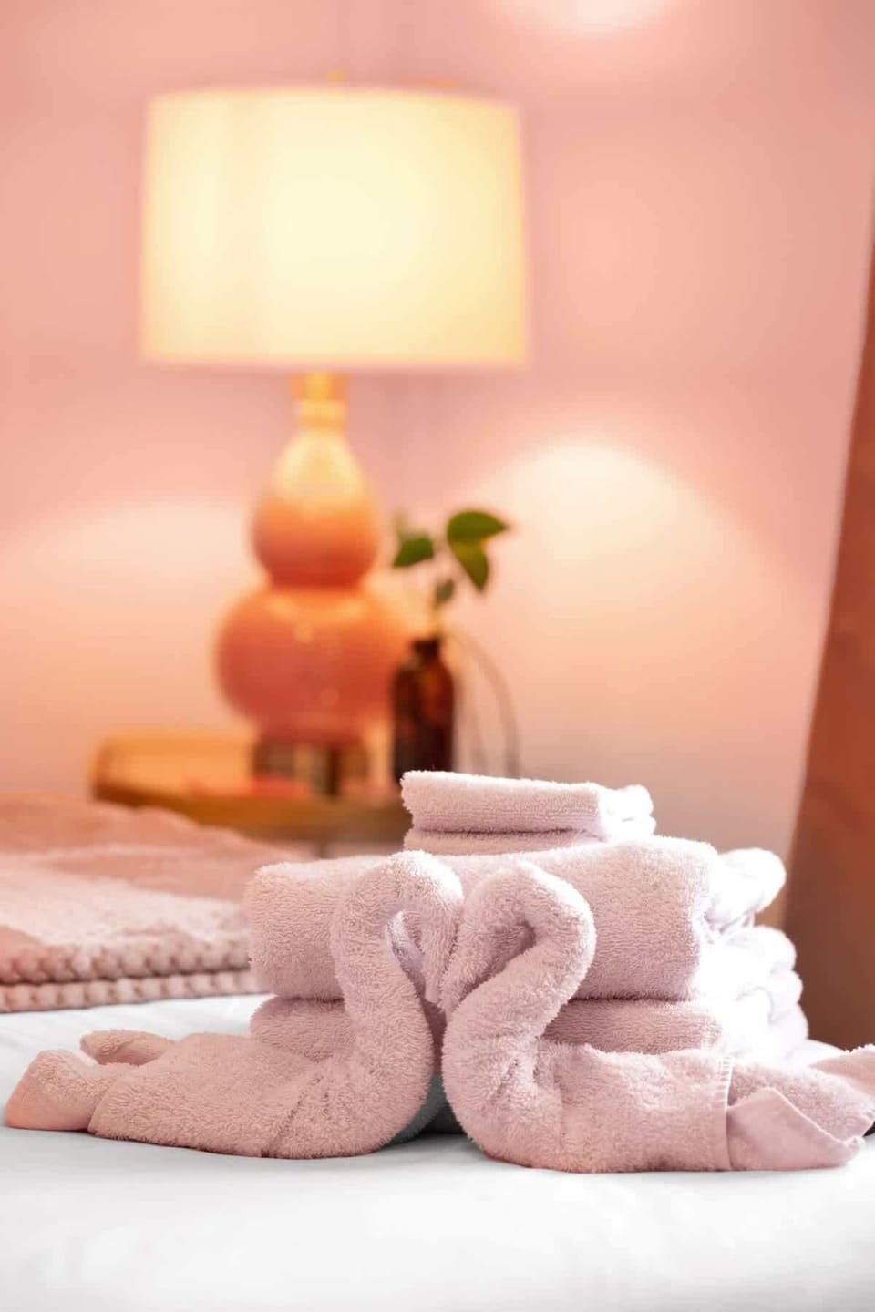 Towel Art: Delight in our whimsical towel displays and soft lighting for a serene retreat!