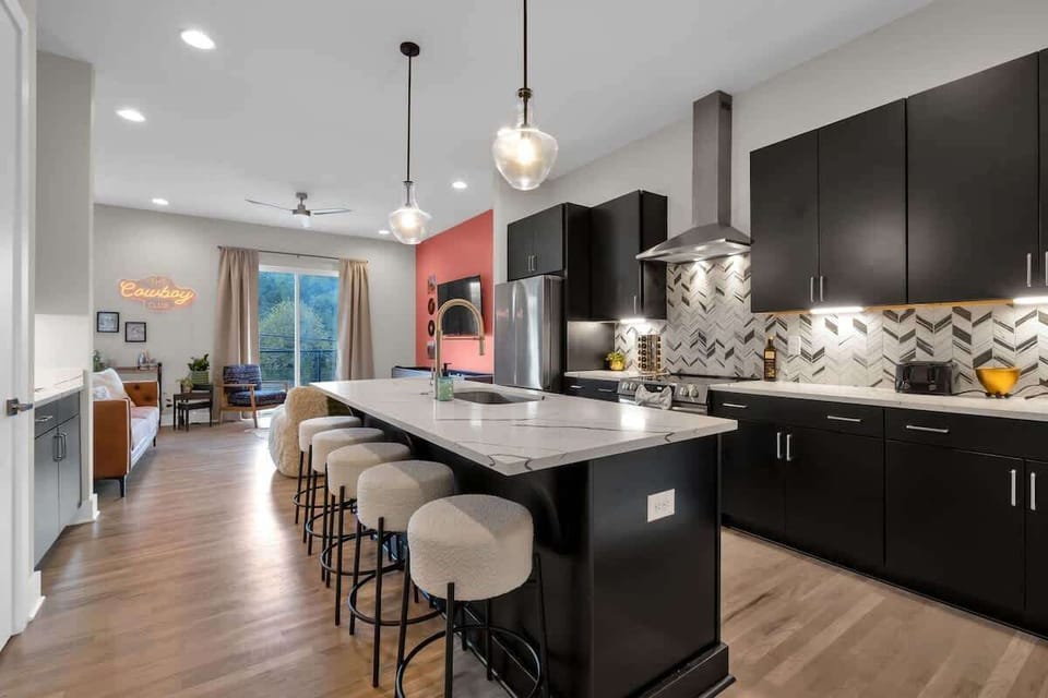 Kitchen: Culinary dreams come true in this stylish space with modern finishes and ample seating!