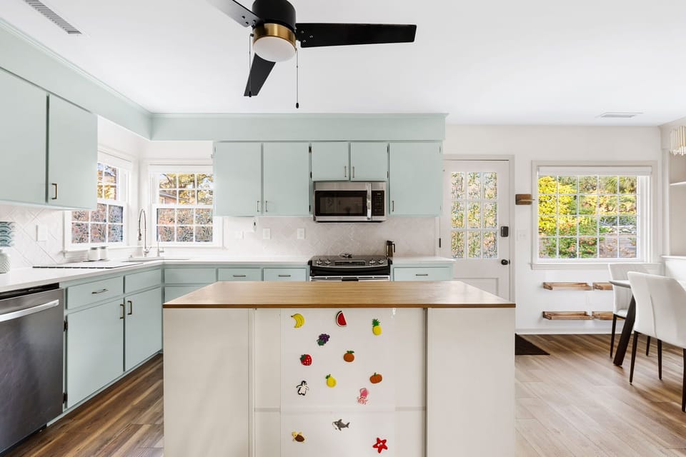 Movable island with kids magnet board included to hopefully help keep littles busy while making food.