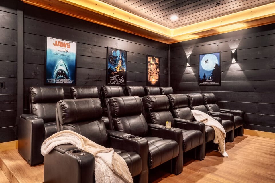 A blacked out movie theater with 12 comfortable seats!