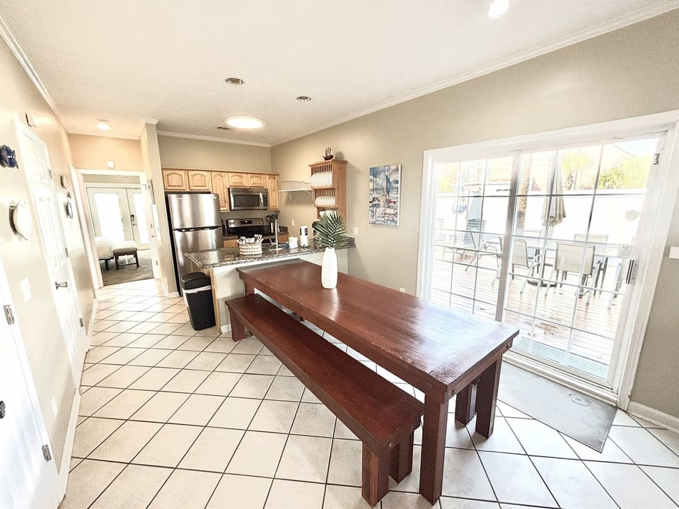Dining area leading to backyard