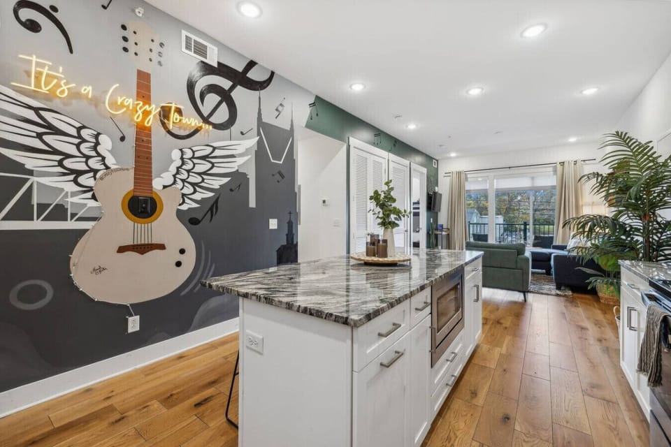 (Crazy Town 203) Welcome to Crazy Town featuring a stunning mural and open concept living and dining spaces.