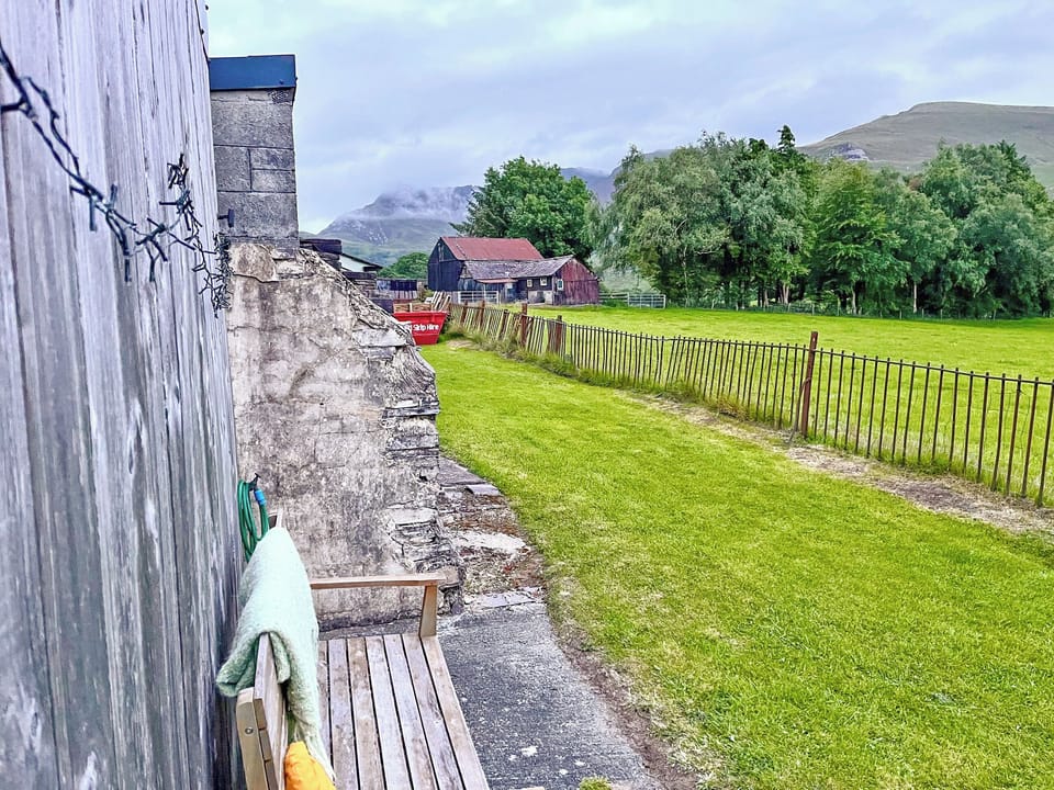 Watching the lake and the mountains from<br />the viewing bench | Wenallt Cottage, Nantlle, Snowdonia National Park