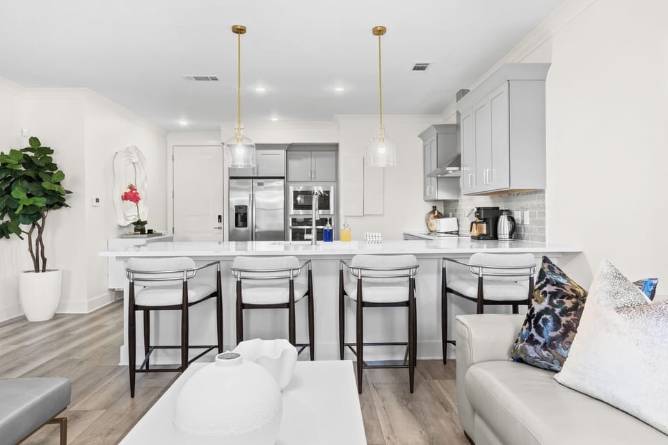 Fully equipped chef’s kitchen with stainless-steel appliances and a spacious breakfast bar.