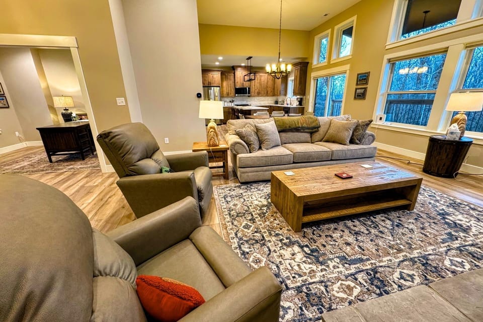 Relax in the living room after a day of play by lounging on the sofa or recliners in front of the gas fireplace or smart TV.
