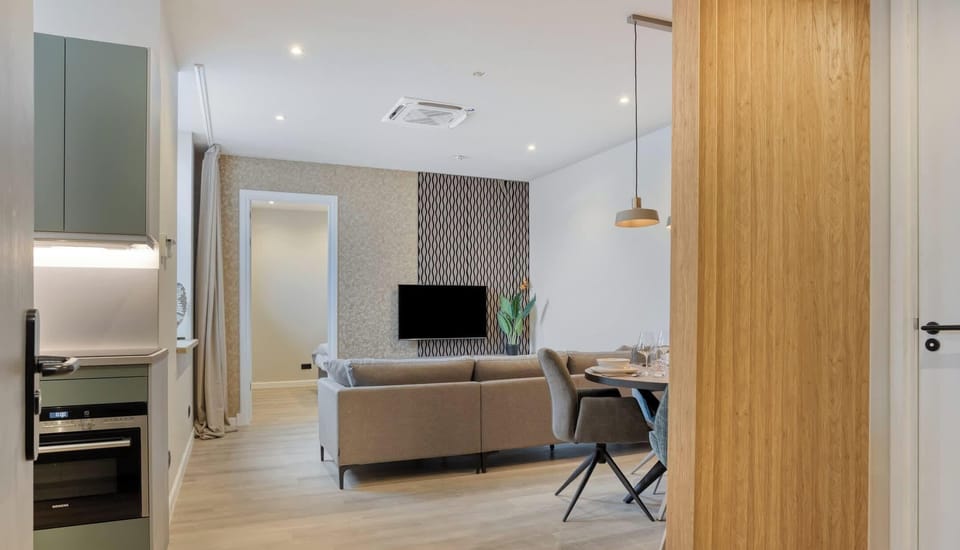 Modern kitchen meets cozy lounge offering a seamless flow for a relaxed stay.