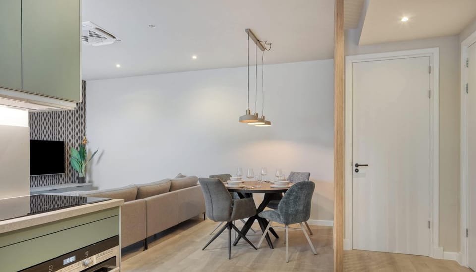 Minimalist dining space with subtle tones and plenty of room to gather.