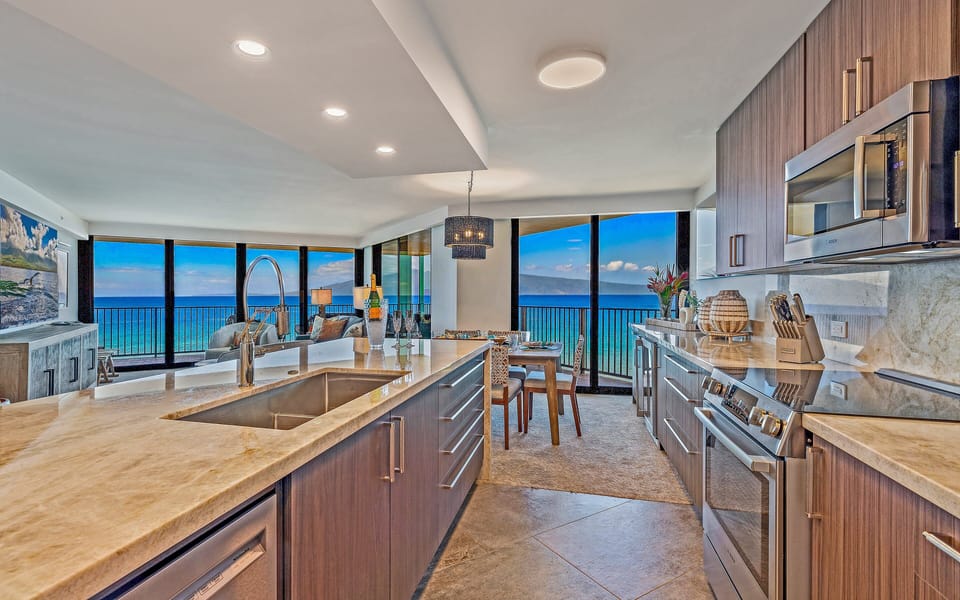 A bright and spacious kitchen designed for culinary creativity with breathtaking ocean scenery