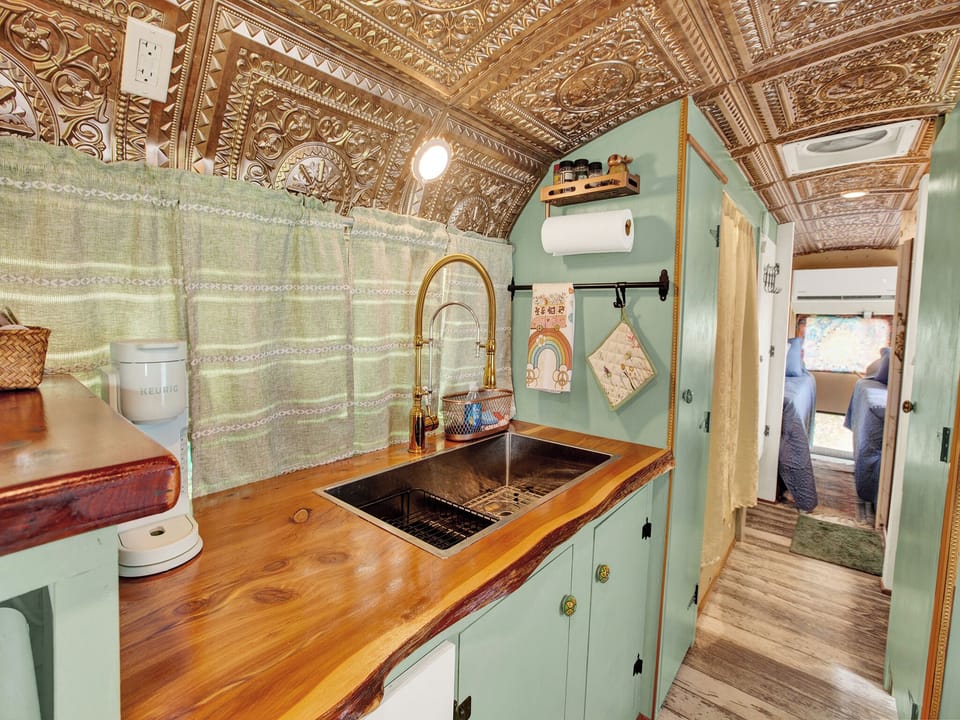 Double sink , linen,utility closet and pantry on left side. Bathroom on right