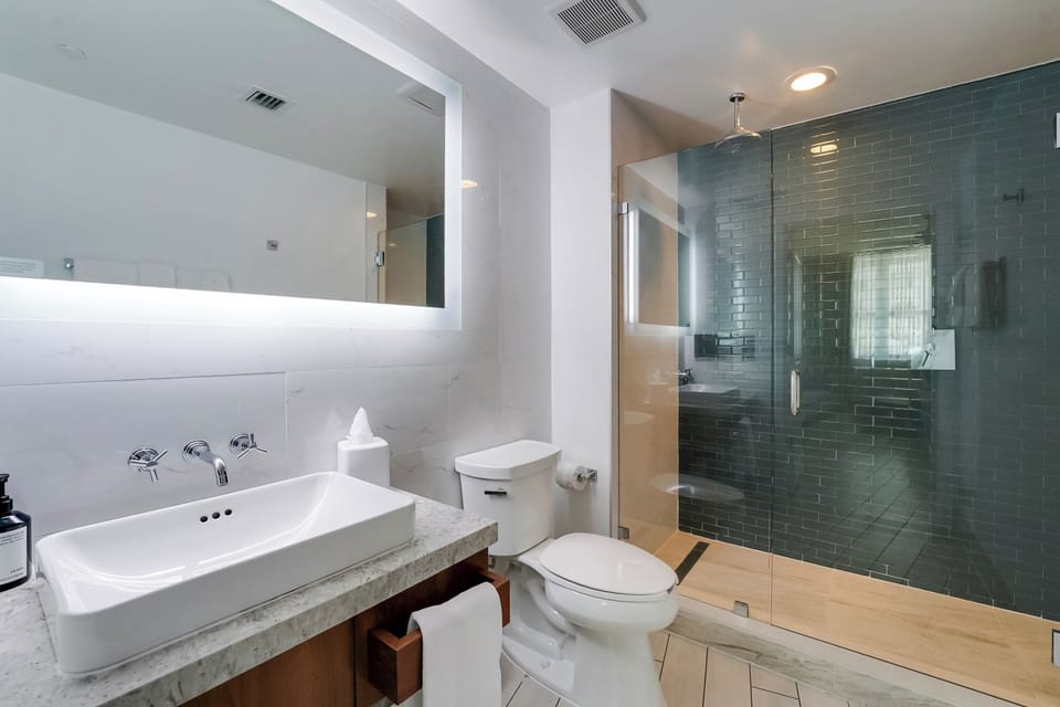 Designer toiletries, hair dryer, towels, soap