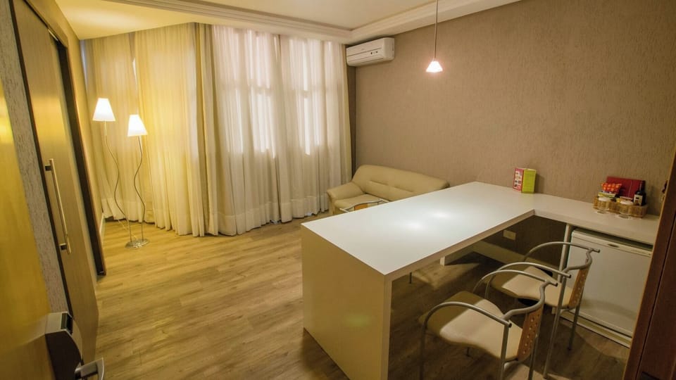 Relax on the sofa and enjoy a roomy table for dining.