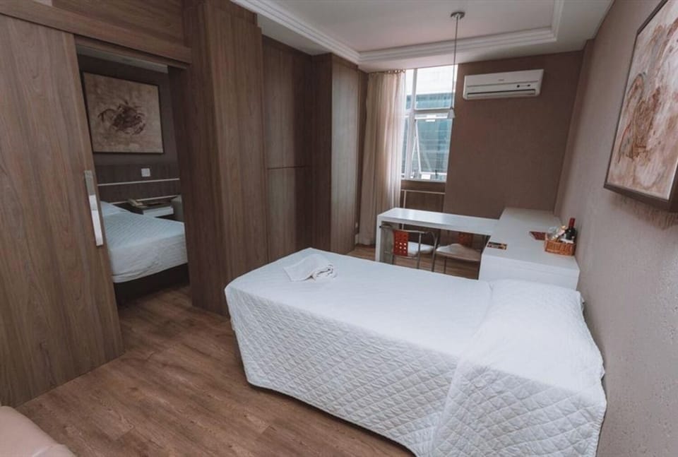 Settle into a bright bedroom with a dedicated work desk.