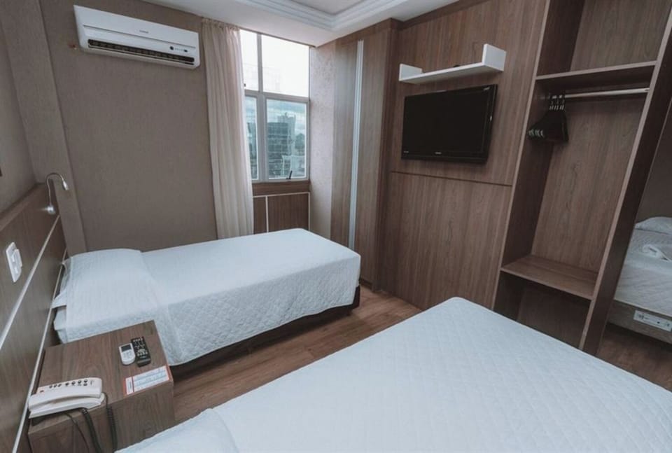 Stretch out in twin beds with TV, AC, and daylight.