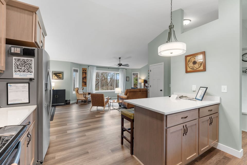 Your open-concept kitchen flows seamlessly into the living area, perfect for relaxing evenings with modern appliances and cozy seating.