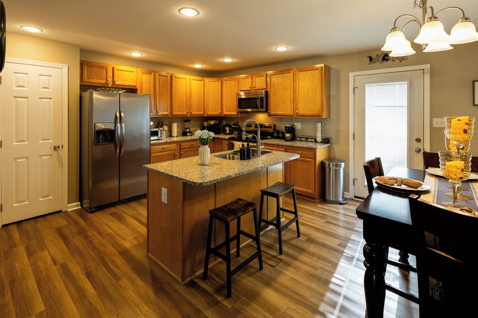 Fully equipped kitchen including blender, rice cooker, toaster, & coffee bar.
