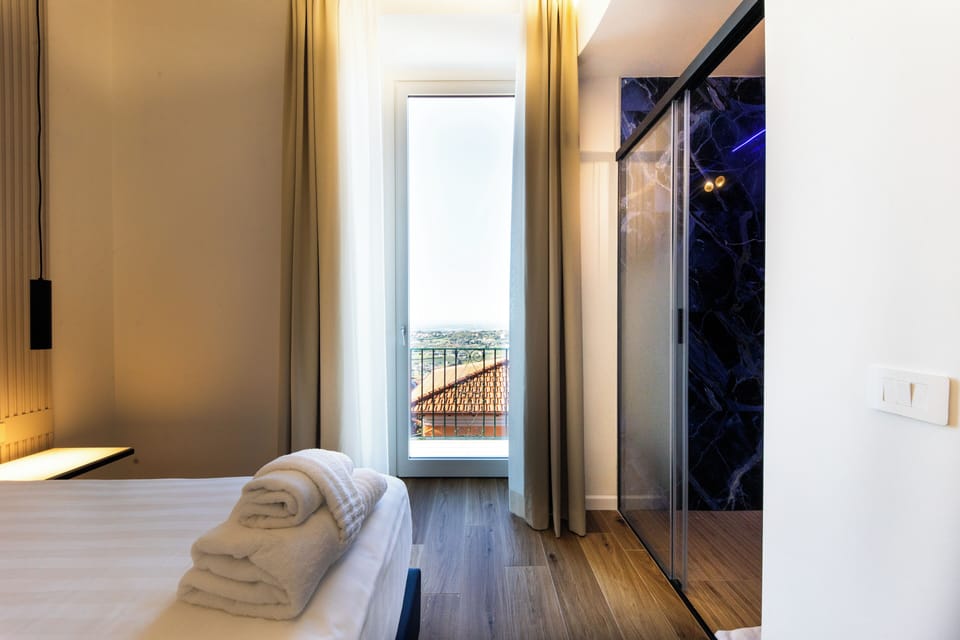 Superior Double Room, Balcony, City View | Minibar, in-room safe, individually decorated, individually furnished