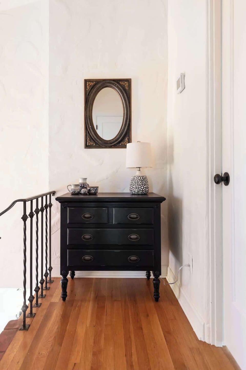 Quaint landing space for last look and extra lighting.