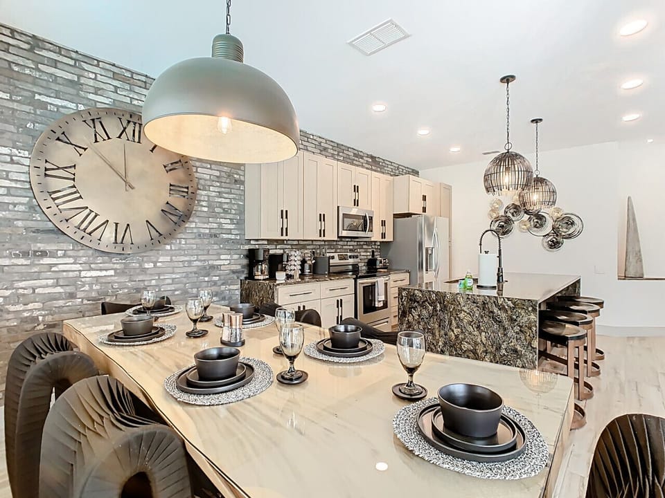 Gather around the beautifully set dining table and enjoy meals in a fully equipped, modern kitchen.