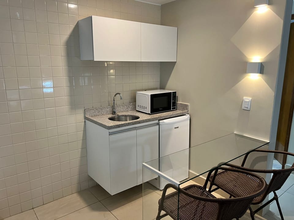 Superior Suite, 1 Bedroom, Kitchenette, Pool View | Private kitchen | Mini-fridge, microwave, highchair, dining tables