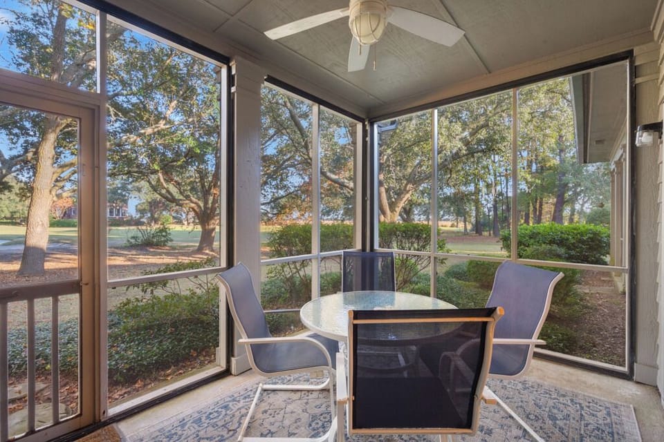 Beautiful screened in patio with views to the 12th Fairway with door to grounds.